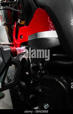 Motorcycle Oil Refill. Replacing engine oil in a sports motorcycle to ensure top performance and engine longevity. Precision oil fill operation on a r Stock Photo