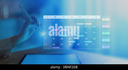 Project Management and Schedule Planning Displayed on a Digital Calendar Interface. Stock Photo