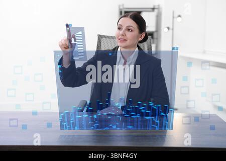 Building information modelling. Woman using virtual screen in office Stock Photo