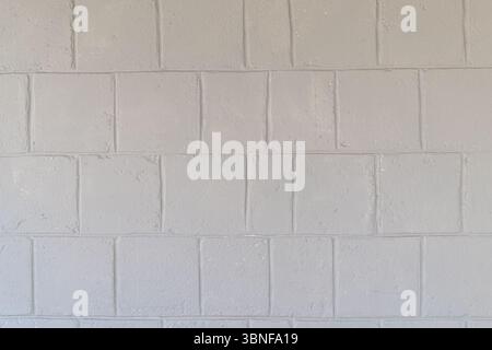 Textured light gray painted concrete block wall. urban background. Stock Photo