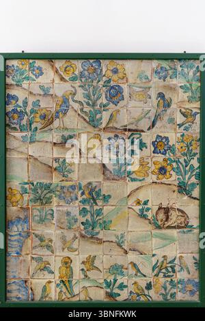 A colorful ceramic tile panel inside the Church of Gesu (Chiesa del Gesu) in Palermo, Sicily featuring hand painted birds, flowers, and foliage in vib Stock Photo