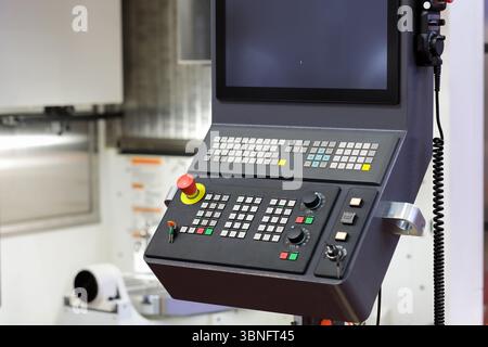 CNC control console of vertical metalworking machining center. Selective focus. Stock Photo