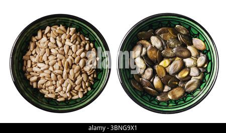 Pumpkin and sunflower seeds. Healthy snack in green ceramic bowls. Object isolated on white. Vegan superfood concept. Dried edible seeds. Stock Photo