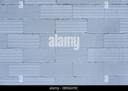Background from a wall made of gray painted bricks Stock Photo