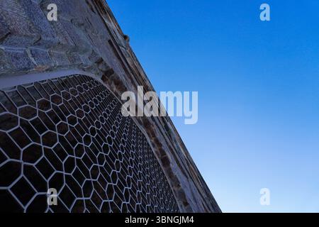 Hexagonal grill on heritage fort wall at Golconda Fort, Hyderabad Stock Photo
