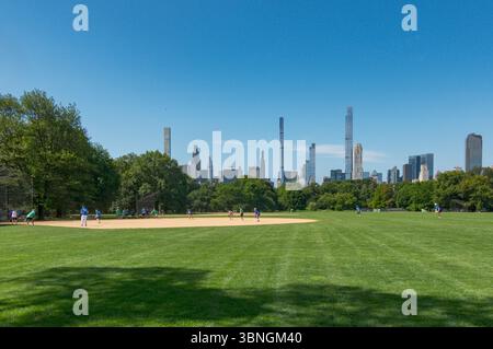 baseball game at Central Park, skyscrapers in background, New York city, USA Stock Photo