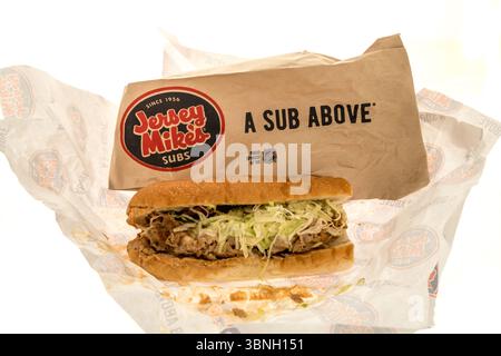 Winneconne, WI - 30 June 2025: A package of Jersey Mikes subs bacon ranch chicken cheese steak with white bread on an isolated background. Stock Photo