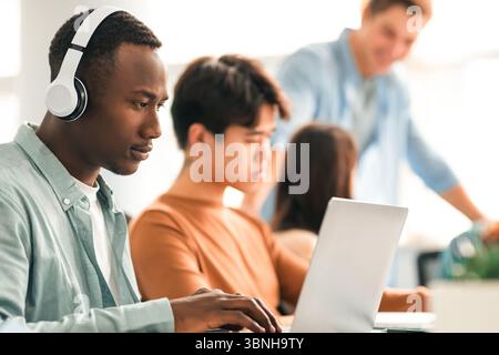 Colleagues working on a project using technology Stock Photo