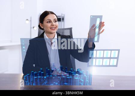 Building information modelling. Woman using virtual screen in office Stock Photo