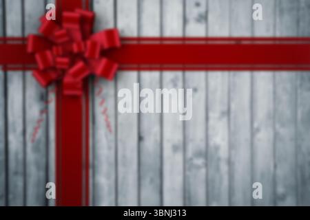 Flat design is featuring bright red satin ribbons forming cross with bow on grey plank background Stock Photo