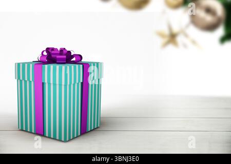 flat design striped gift box is resting on pale wood surface, blurred ornaments hanging behind Stock Photo