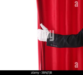 Magician's hand opening red velvet curtain on white background Stock Photo