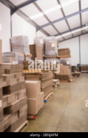 Stack of cardboard boxes against wall Stock Photo