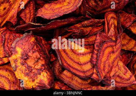 A close-up view of dried beetroot texture, showcasing its vibrant red and orange hues. Perfect for backgrounds, this image highlights the natural beau Stock Photo