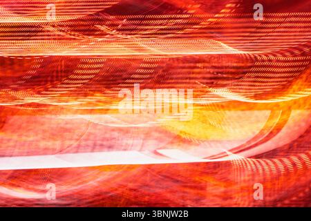 Abstract light background featuring vibrant orange and yellow streaks in dynamic motion. The fluid patterns create a sense of energy and movement, for Stock Photo