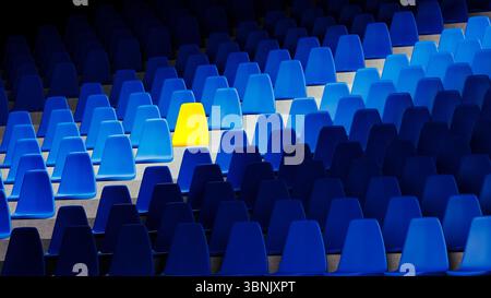A vivid yellow stadium seat sits alone among a sea of blue chairs, creating a striking visual contrast in an organized setting. Stock Photo