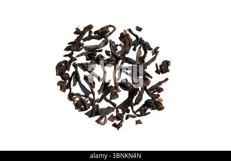 Dry tea sample isolated. Green dry tea leaves close-up. Stock Photo