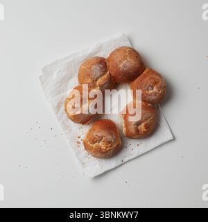 Chocolate round donuts on white paper Stock Photo