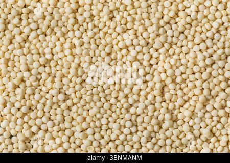 Dry Raw Organic Couscous in a Bowl to Cook Stock Photo