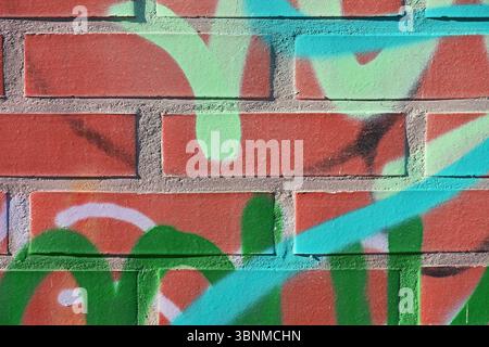 Colorful graffiti on a brick wall Stock Photo