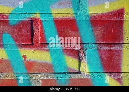 Colorful graffiti on a brick wall Stock Photo