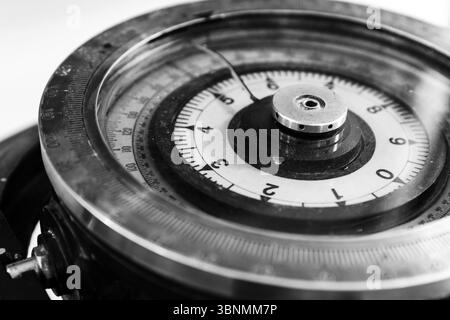 An abstract black and white macro shot of naval compass, showcasing intricate navigation details and components Stock Photo