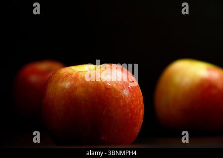 Set of pictures of apples on a black background Stock Photo