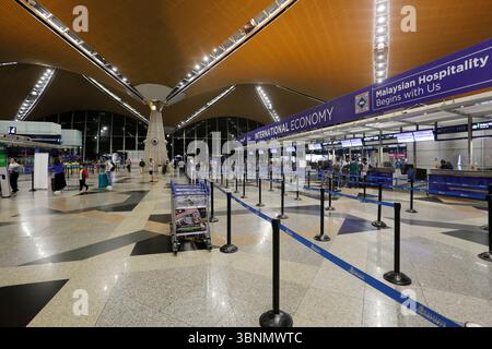 Kuala Lumpur, Malaysia - December 6, 2022: Panoramic view of KLIA international airport check-in area. Malaysia's biggest and busiest airport. Stock Photo