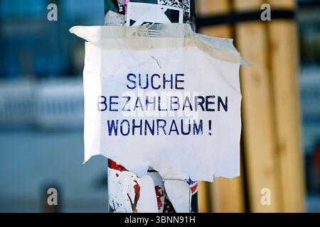 Flyer with the inscription Search for affordable housing on a lamp post, photomontage Stock Photo