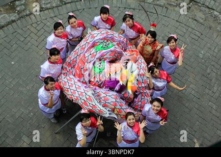 The beauty of a Chinese girls who took part in the carnival of the Yogyakarta XI Chinese Cultural Week which took place along Malioboro. Stock Photo