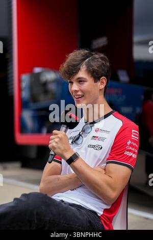 Sliverstone, Britain. 3rd July, 2025. Haas' driver Oliver Bearman of Britain is interviewed during the press day before the race of the Formula One British Grand Prix 2025 in Sliverstone, Britain, July 3, 2025. Credit: Wu Lu/Xinhua/Alamy Live News Stock Photo