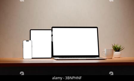 Laptop, mobile phone and tablet with blank screen for responsive Web Design and website Mockup. Digital devices over an office wooden desk. Stock Photo