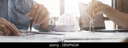 Man architect working On the desk construction project ideas architects engineer Concept Stock Photo