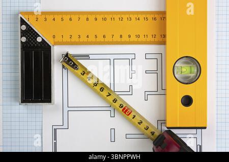 Development drawings and tools on graph paper Stock Photo