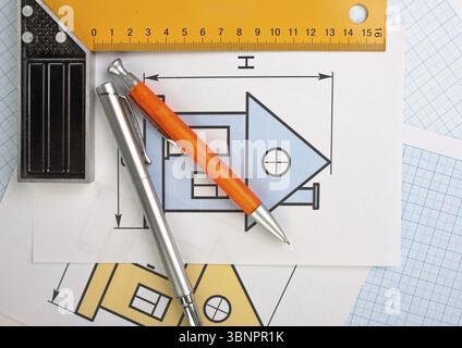 Development drawings and tools on graph paper Stock Photo