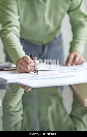 Close up Millennial confident Female working in creative office Stock Photo