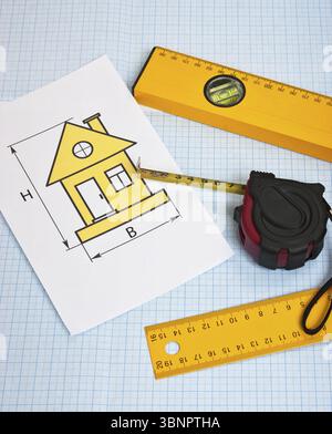 Development drawings and tools on graph paper Stock Photo