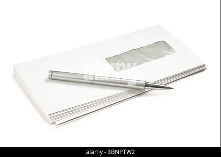 Stack of mail envelopes and a pen isolated on white background Stock Photo