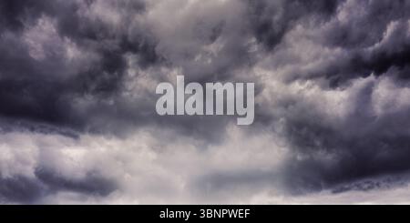 Mass of storm clouds is forming in flat design illustration, showing dark turbulent sky Stock Photo