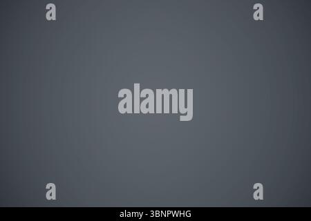 Subtle radial gradient is being shown on smooth uniform grey surface in flat design Stock Photo
