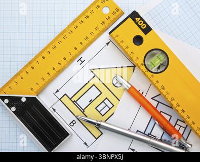 Development drawings and tools on graph paper Stock Photo