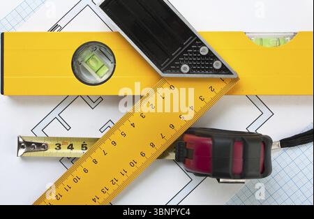 Development drawings and tools on graph paper Stock Photo