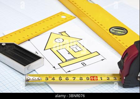 Construction drawings and tools on graph paper Stock Photo