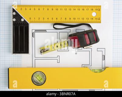 Development drawings and tools on graph paper Stock Photo