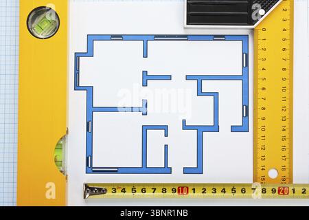 Development drawings and tools on graph paper Stock Photo