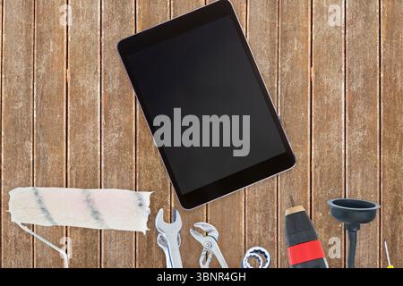 Tools and tablet on wooden background Stock Photo