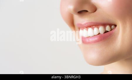 CloseUp View of a Cheerful and Smiling Woman Showcasing Her Radiant and Bright Smile Stock Photo