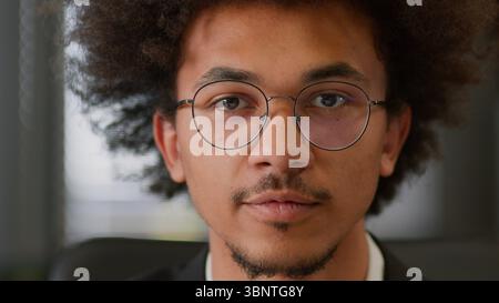 Portrait close up headshot indoors African American ethnic business man businessman guy male employer entrepreneur student manager leader work at Stock Photo