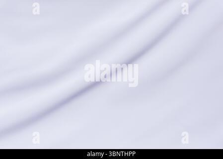 Soft diagonal fabric lines in white cloth, great for minimal backgrounds, branding visuals, or textile-focused abstract art Stock Photo