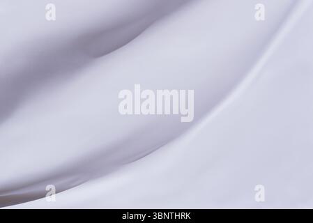 Elegant white fabric surface with natural soft curves, ideal for branding mockups, clean presentations, or calm visual layers Stock Photo